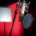 Professional microphone recording voice in music studio